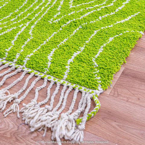 Bright Green Moroccan Rug with Tree Trunk-Inspired White Patterns Bright Green Moroccan Rug with Tree Trunk-Inspired White Patterns