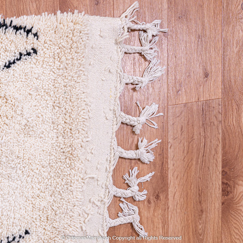 Minimalist Beni Ourain Moroccan Rug with Black Diamond Patterns on Ivory Wool Minimalist Beni Ourain Moroccan Rug with Black Diamond Patterns on Ivory Wool