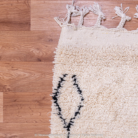 Minimalist Beni Ourain Moroccan Rug with Black Diamond Patterns on Ivory Wool Minimalist Beni Ourain Moroccan Rug with Black Diamond Patterns on Ivory Wool