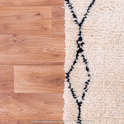 Minimalist Beni Ourain Moroccan Rug with Black Diamond Patterns on Ivory Wool Minimalist Beni Ourain Moroccan Rug with Black Diamond Patterns on Ivory Wool