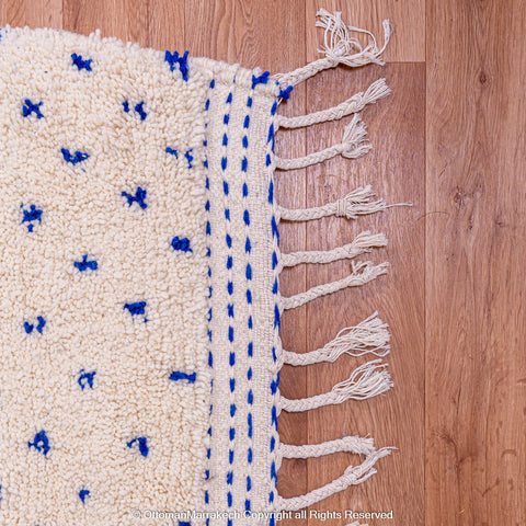 White Natural Wool Rug with Blue Dots and Embroidered Margins White Natural Wool Rug with Blue Dots and Embroidered Margins