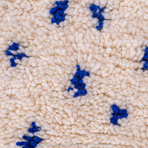 White Natural Wool Rug with Blue Dots and Embroidered Margins White Natural Wool Rug with Blue Dots and Embroidered Margins