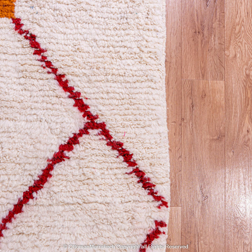 Moroccan White Berber Rug with Red and Orange Geometric Accents