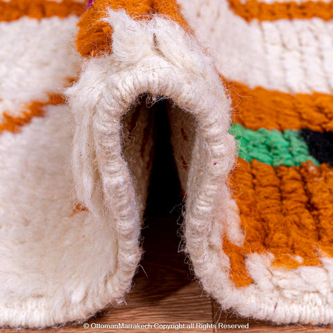 Moroccan White Berber Rug with Red and Orange Geometric Accents