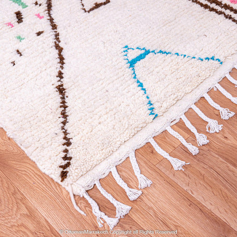 White Berber Rug with Soft Geometric Symbols and Pink Accents