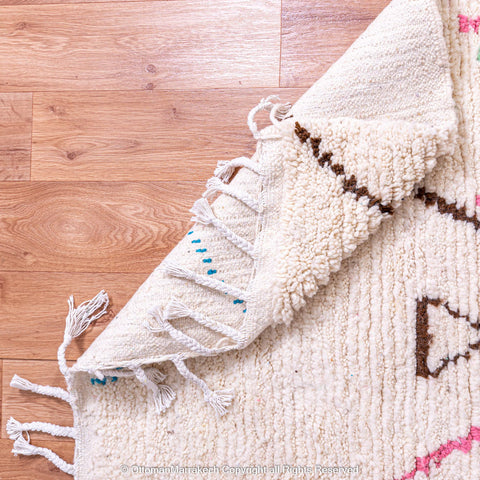 White Berber Rug with Soft Geometric Symbols and Pink Accents