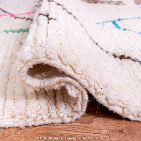 White Berber Rug with Soft Geometric Symbols and Pink Accents