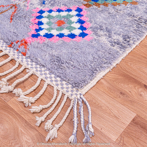 Gradient Blue Berber Rug with Colorful Geometric Symbols and Natural Sheep Wool Accents