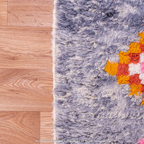 Gradient Blue Berber Rug with Colorful Geometric Symbols and Natural Sheep Wool Accents