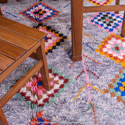 Gradient Blue Berber Rug with Colorful Geometric Symbols and Natural Sheep Wool Accents