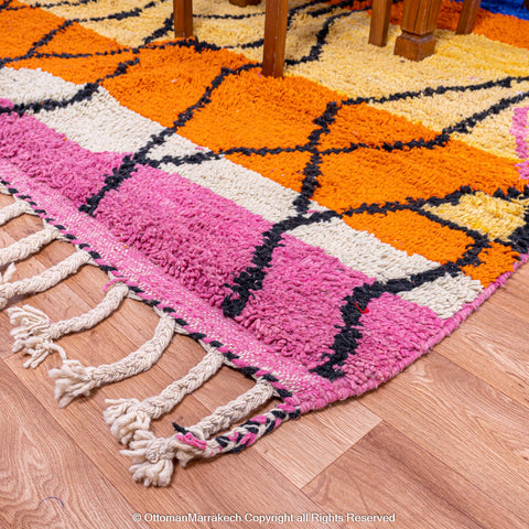 Vibrant Moroccan Geometric Rug with Bold Black Lines and Orange-Pink Stripes