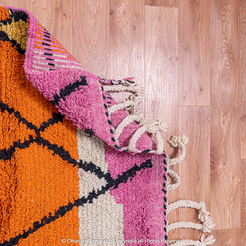 Vibrant Moroccan Geometric Rug with Bold Black Lines and Orange-Pink Stripes