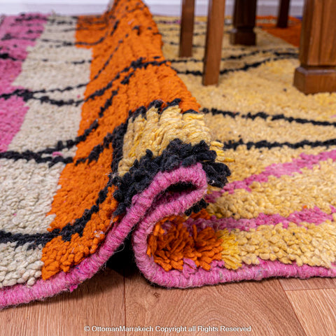 Vibrant Moroccan Geometric Rug with Bold Black Lines and Orange-Pink Stripes