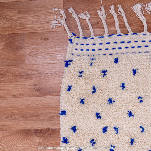 White Natural Wool Rug with Blue Dots and Embroidered Margins