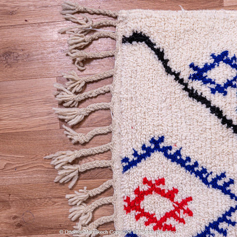 White Beni Ourain Rug with Black Diamond Lines and Colorful Berber Symbols