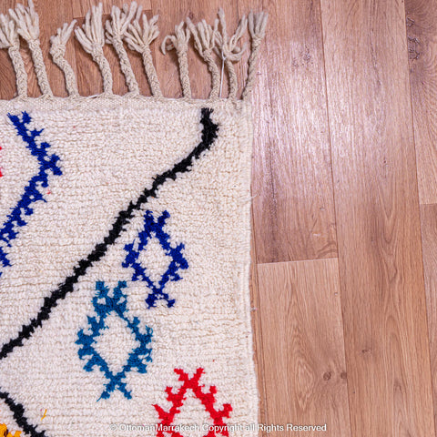 White Beni Ourain Rug with Black Diamond Lines and Colorful Berber Symbols