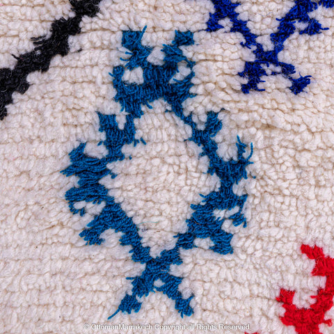 White Beni Ourain Rug with Black Diamond Lines and Colorful Berber Symbols