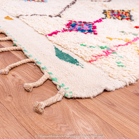 Handwoven Moroccan Rug with Colorful Diamond Pattern and Side Floral Embroidery