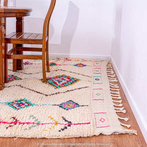 Handwoven Moroccan Rug with Colorful Diamond Pattern and Side Floral Embroidery