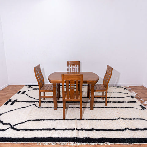 Symmetrical Black and White Berber Rug with Reversed Shapes