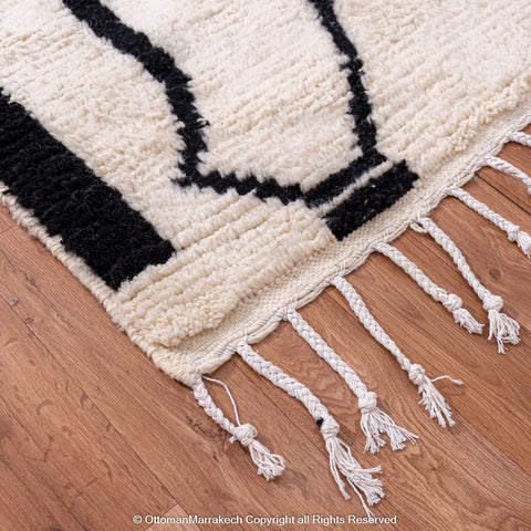 Symmetrical Black and White Berber Rug with Reversed Shapes