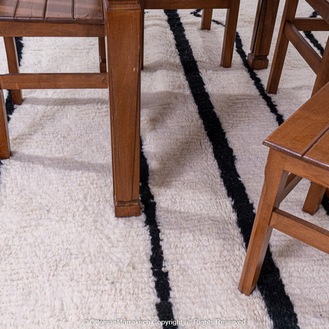 Symmetrical Black and White Berber Rug with Reversed Shapes