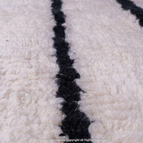 Symmetrical Black and White Berber Rug with Reversed Shapes