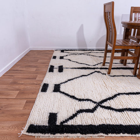 Symmetrical Black and White Berber Rug with Reversed Shapes